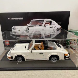 buy in bulk thickened clear acrylic display case for lego 10295 10265 42170 42155 42176 75376 collectibles, transparent box dustproof protection with wood-plastic base & string light, black inside 15.7x7.9x7.9in source from factory